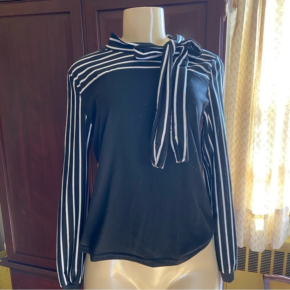 Adorable and soft knit top with striped tie and striped sleeves. Classic look.